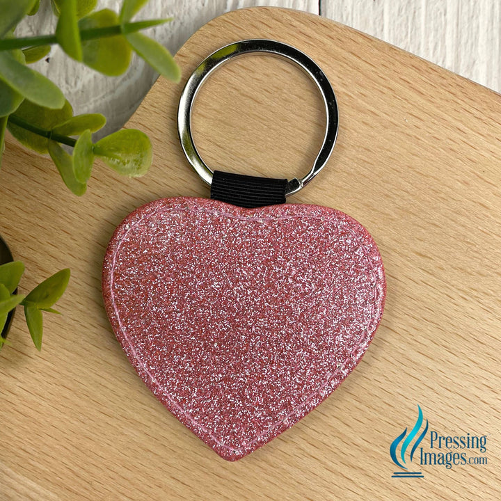 Pink glitter heart keychain with a faux leather back for sublimation